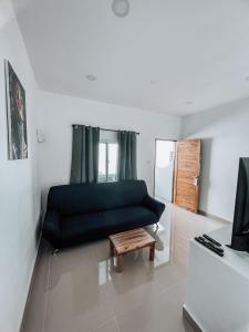 a living room with a couch and a coffee table at L.C. Apartments in Nathon Bay