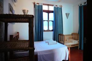 Postel nebo postele na pokoji v ubytování Jambo Kendwa Villa