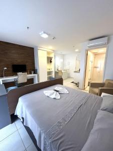 En eller flere senge i et værelse på F616 FJ Flat com WI-FI exclusivo em Região Central