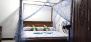 Ένα ή περισσότερα κρεβάτια σε δωμάτιο στο top sea view guest
