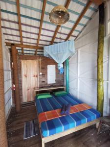 Postel nebo postele na pokoji v ubytování Amaranthe Beach Cabanas