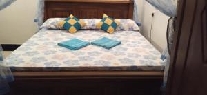 Ένα ή περισσότερα κρεβάτια σε δωμάτιο στο top sea view guest