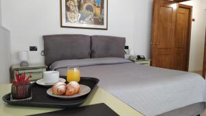 Posteľ alebo postele v izbe v ubytovaní Villa Scaduto Residence