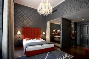 Postel nebo postele na pokoji v ubytování Small Luxury Hotel Altstadt Vienna