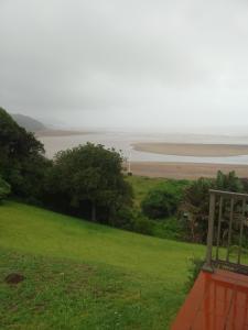 a view of the beach from a house at Ocean View Guest House in Port St. Johns