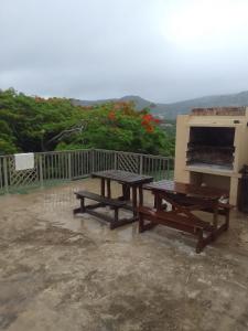 a picnic table and an oven on a patio at Ocean View Guest House in Port St. Johns