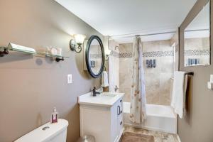 a bathroom with a sink and a toilet and a shower at 2 Mi to Dtwn Grand Junction Home with Hot Tub in Grand Junction +18 photos