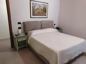 Posteľ alebo postele v izbe v ubytovaní Villa Scaduto Residence