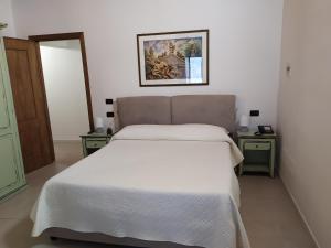 Posteľ alebo postele v izbe v ubytovaní Villa Scaduto Residence