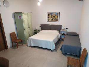 Posteľ alebo postele v izbe v ubytovaní Villa Scaduto Residence