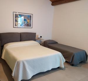 Posteľ alebo postele v izbe v ubytovaní Villa Scaduto Residence