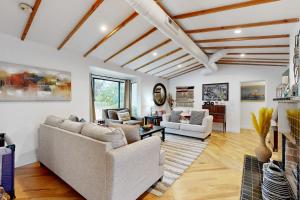 a living room with two couches and a fireplace at Encanto Dreams in Phoenix