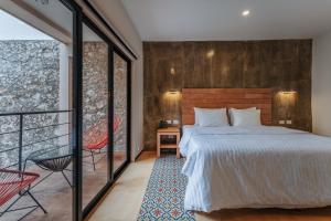 Postel nebo postele na pokoji v ubytování Hotel Casa 57 + 37 fotografií
