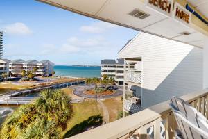 a balcony with a view of the ocean at Baywatch F9 in Pensacola Beach