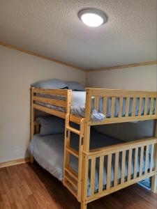 a bunk bed room with two bunk beds at HTR Adirondacks in Old Forge