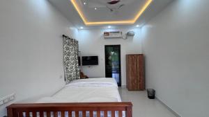 Postel nebo postele na pokoji v ubytování Mali Homestays
