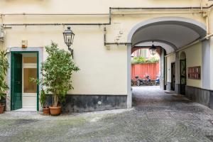 an entrance to a building with an archway at Kea Home, entire house in the heart of Naples in Naples