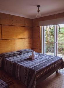 Giường trong phòng chung tại Casa loft con opción de tina temperada