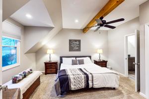 a bedroom with a bed and a ceiling fan at Leisure Lake in Oakland