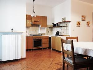 a kitchen with a table and a radiator in it at A casa di Titti Arezzo in Arezzo