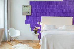 Postel nebo postele na pokoji v ubytování Small Luxury Hotel Altstadt Vienna