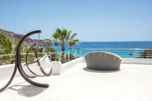 a metal sculpture on a balcony with the ocean at Villa Rica Beach in Ibiza Town
