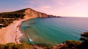 an aerial view of a beach next to the ocean at Villa Rica Beach in Ibiza Town