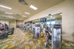 a gym with lots of treadmills and machines at Coastal Oasis Retreat at The Palms of Destin! in Destin