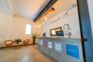a lobby with a reception desk in a room at La Ferreteria Apartments in San Juan
