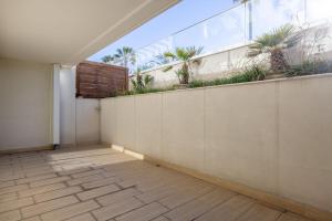 an empty balcony with plants on a wall at LE MIDI 8 by ESTATES CANNES in Cannes