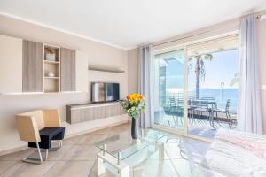 a living room with a view of the ocean at LE MIDI 8 by ESTATES CANNES in Cannes