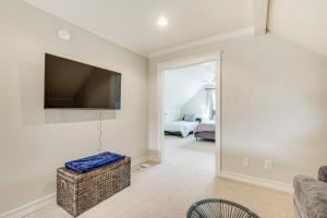 a living room with a flat screen tv on the wall at Brenham Rental with Deck and Yard Less Than 1 Mi to Downtown! in Brenham