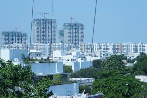 a view of a city with tall buildings at Veetil -3BHK A/C, Kukatpally, Hyderabad in Hyderabad
