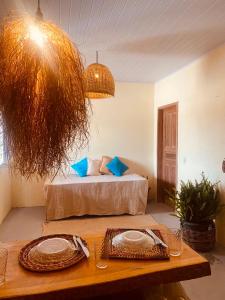 En eller flere senge i et værelse på Casa na vila de Caraíva