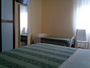 Voodi või voodid majutusasutuse Hotel Sette Note toas