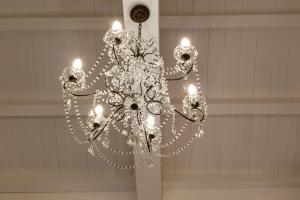 a chandelier hanging from a ceiling in a room at MCH-Marina Charming House in Cagliari