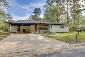 a house with a driveway in front of it at Chic Tallahassee Vacation Rental Near Universities in Tallahassee