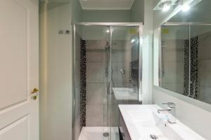 a bathroom with a shower and a sink at Luxury Three Bedrooms flat in Roma Center in Rome