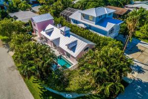 an aerial view of a house with palm trees at Little Pink Houses in Anna Maria