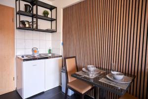 Η κουζίνα ή μικρή κουζίνα στο Mivano Apartments - Am Bahnhof