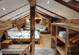 a large room with a bed and a couch at Boutique Hotel de la Croix-Fédérale in Leukerbad