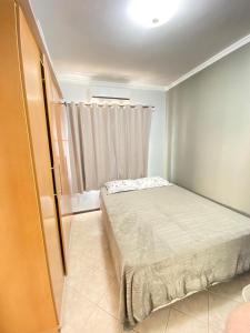 Ένα ή περισσότερα κρεβάτια σε δωμάτιο στο Apartamento próximo praia Balneário Camboriú