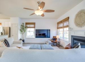 a living room with a ceiling fan and a fireplace at 4 Mi to Bethany Beach Frankford Getaway with Pool! in Frankford