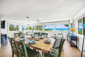 a dining room with a table and chairs at Bay Vista at Bayside Bungalow in Anna Maria