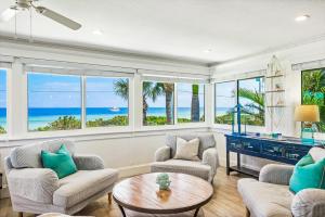 a living room with a view of the ocean at Bay Vista at Bayside Bungalow in Anna Maria