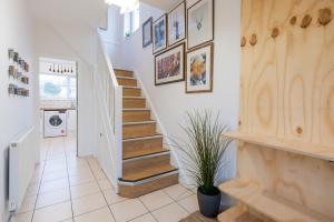 a staircase in a home with white walls at Brett Stays - Middleton Oasis in Avonmouth