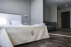Кровать или кровати в номере Apart Hotel Kvartira 1
