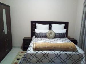 a bedroom with a bed with a pillow on it at Protea Avenue Margate in Margate