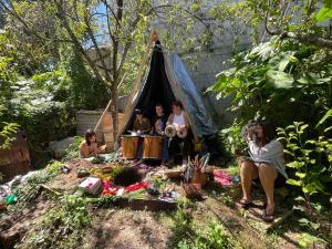 a group of people sitting in a tent at Historika Hostel Cultural in San Cristóbal de Las Casas