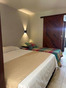 Cama ou camas em um quarto em Taiba Beach Resort